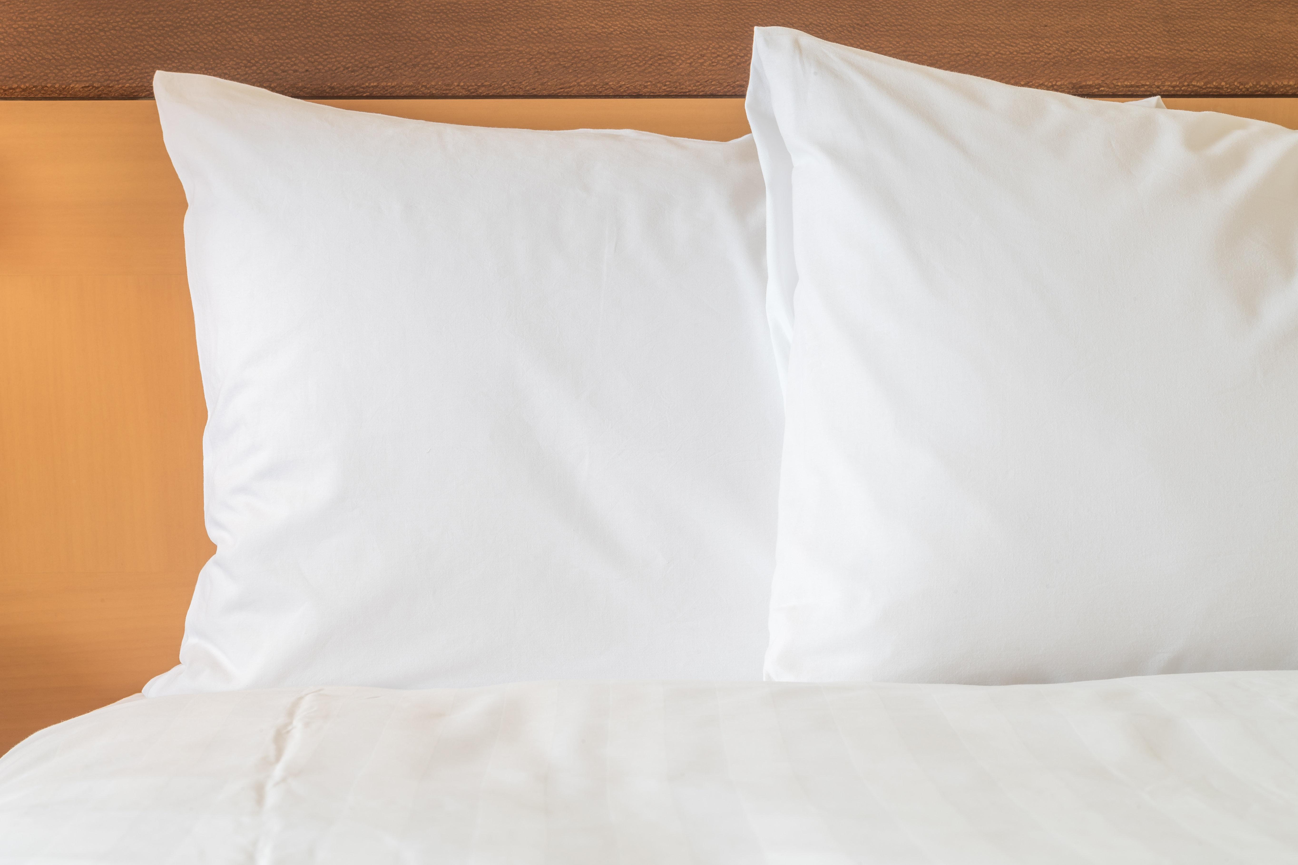 Holiday Inn Express Guaymas By Ihg Bagian luar foto Two pillows on a bed